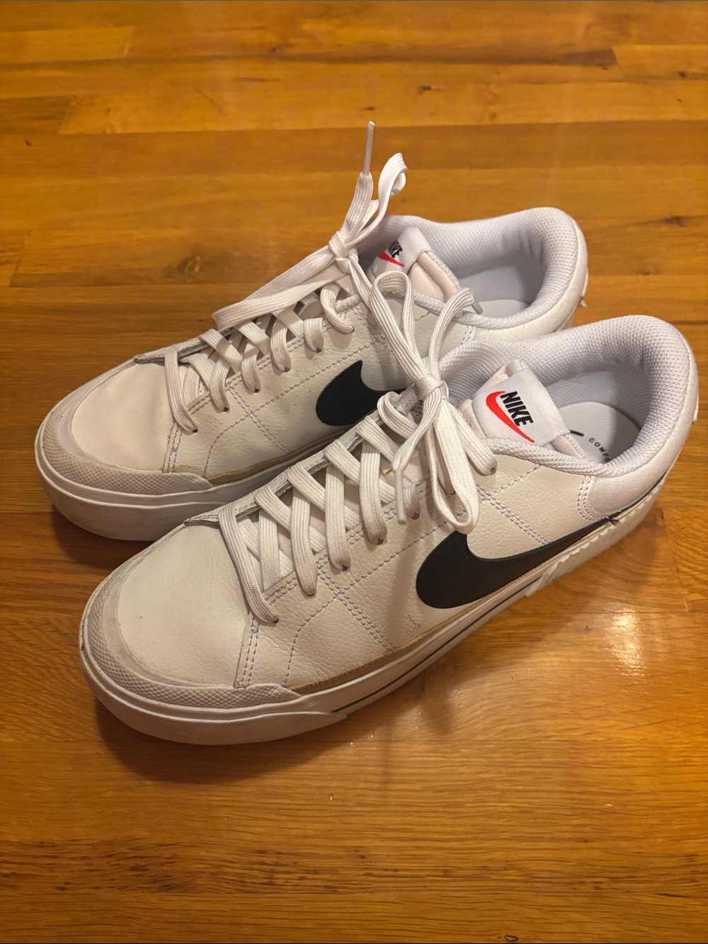 Nike Women’s  White Low-Top Sneakers with Black Swoosh